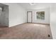 Cozy living room with ample natural light streaming through a large window at 12116 N Fairfax St, Thornton, CO 80241