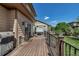 Backyard deck view with a barbeque grill and hot tub overlooking a landscaped yard at 21658 E Tallkid Ave, Parker, CO 80138