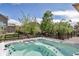 Backyard view from hot tub featuring well maintained grass, landscaping, and privacy fence at 21658 E Tallkid Ave, Parker, CO 80138