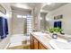 Neutral bathroom showcasing a double vanity, a shower/tub combo, and stylish accents at 21658 E Tallkid Ave, Parker, CO 80138