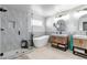 Luxurious bathroom with double sink vanity, standalone tub and glass enclosed shower at 21658 E Tallkid Ave, Parker, CO 80138