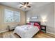 Bedroom features a window with plantation shutters and a decorative bench at 21658 E Tallkid Ave, Parker, CO 80138