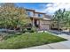 Charming two-story home with a well-manicured lawn and a spacious driveway at 21658 E Tallkid Ave, Parker, CO 80138