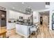 Bright open kitchen features a large island, stainless steel appliances, and custom cabinets at 21658 E Tallkid Ave, Parker, CO 80138