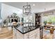 Open concept kitchen and living area features a large island, and dining area at 21658 E Tallkid Ave, Parker, CO 80138