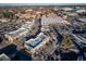 Aerial view of a shopping center with stores and ample parking at 7777 E 1St Pl # 110, Denver, CO 80230