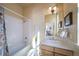 Clean and simple bathroom with tub and shower combo at 7777 E 1St Pl # 110, Denver, CO 80230