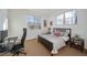 Bedroom with a workspace and a comfortable bed at 7777 E 1St Pl # 110, Denver, CO 80230