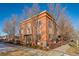 Side view of the home highlighting its architecture and landscaping at 7777 E 1St Pl # 110, Denver, CO 80230