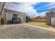 A spacious backyard with a gravel area and a grassy area, surrounded by a wooden fence at 2827 Bellaire St, Denver, CO 80207