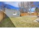 Spacious backyard with green grass and privacy fence at 2827 Bellaire St, Denver, CO 80207