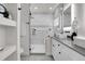 Sleek bathroom with a glass-enclosed shower, marble accents, and modern vanity at 2827 Bellaire St, Denver, CO 80207