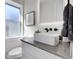 Stylish bathroom with a modern vanity, sleek fixtures, and natural light at 2827 Bellaire St, Denver, CO 80207