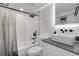 Modern bathroom showcasing a sleek shower, elegant fixtures, and stylish vanity at 2827 Bellaire St, Denver, CO 80207