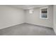 Carpeted bedroom features two windows and neutral walls at 2827 Bellaire St, Denver, CO 80207