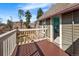 A cozy wooden balcony offers an inviting outdoor space with open access to the bedroom at 1433 Olive St, Denver, CO 80220