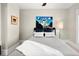Cozy bedroom with a comfortable bed and a unique art piece at 1433 Olive St, Denver, CO 80220