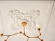 Ornate ceiling with decorative plasterwork and a modern chandelier fixture at 1433 Olive St, Denver, CO 80220