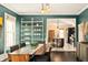 Dining room with view to a modern kitchen at 1433 Olive St, Denver, CO 80220
