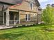 A charming home featuring a lush lawn and colorful flower beds along the walkway at 1433 Olive St, Denver, CO 80220