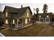 Charming two-story home with a detached two-car garage and well-maintained front yard at 1433 Olive St, Denver, CO 80220