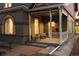 Charming covered front porch with seating area for relaxing and enjoying the outdoors at 1433 Olive St, Denver, CO 80220
