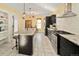 Well-equipped kitchen with stainless steel appliances, granite countertops, ample cabinet space, and a center island with seating at 1433 Olive St, Denver, CO 80220