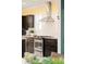 Close-up of kitchen appliances and cabinetry; stainless steel range hood at 1433 Olive St, Denver, CO 80220