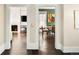 Spacious living room that leads to a dining room area showing an inviting and seamless flow, perfect for gatherings at 1433 Olive St, Denver, CO 80220