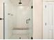 Modern bathroom featuring a glass shower enclosure and tiled walls at 1433 Olive St, Denver, CO 80220
