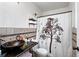 Bathroom features tile floors, granite counters and decorative shower curtain at 1419 Swan Ave, Brighton, CO 80601