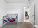 Bedroom featuring a bed, open door and view of other parts of the house at 1419 Swan Ave, Brighton, CO 80601