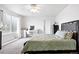 Bright bedroom with neutral carpet, white walls, and ample natural light at 1419 Swan Ave, Brighton, CO 80601