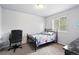 Bright bedroom featuring a cozy bed with sports-themed bedding and a dedicated workspace at 1419 Swan Ave, Brighton, CO 80601