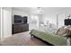 Spacious bedroom features large window for natural light and neutral decor at 1419 Swan Ave, Brighton, CO 80601