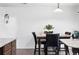 Bright dining area featuring a modern table with seating and tile flooring at 1419 Swan Ave, Brighton, CO 80601