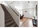 Entryway view showcasing staircase, tile floors, and access to the living room at 1419 Swan Ave, Brighton, CO 80601