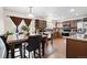Well-equipped kitchen with granite countertops, stainless steel appliances, and an adjacent dining area at 1419 Swan Ave, Brighton, CO 80601