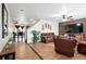 Comfortable living room showcasing tile flooring, an accent wall, and an open layout at 1419 Swan Ave, Brighton, CO 80601