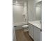 Clean bathroom featuring a shower-tub combo with white tiling and a modern vanity with a quartz countertop at 21966 E 39Th Pl, Aurora, CO 80019