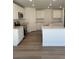 Modern kitchen featuring white cabinets, stainless steel appliances, and a center island with granite countertops at 21966 E 39Th Pl, Aurora, CO 80019
