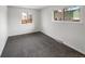 Carpeted bedroom with a large window and neutral walls providing ample natural light at 9976 Appletree Pl, Thornton, CO 80260