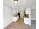 Eat-in kitchen area featuring white cabinets, laminate countertops, and black appliances at 9976 Appletree Pl, Thornton, CO 80260