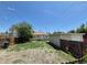 View of the backyard, two-car garage, and the fenced yard at 1303 Havana St, Aurora, CO 80010