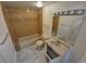 Full bathroom featuring tub and shower with modern vanity and light at 1303 Havana St, Aurora, CO 80010