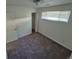 Bedroom with neutral carpet, standard closet, and natural light at 1303 Havana St, Aurora, CO 80010