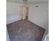 Bedroom with neutral carpet, standard closet, and view to the hallway at 1303 Havana St, Aurora, CO 80010