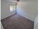 Bedroom featuring a standard window and neutral carpet at 1303 Havana St, Aurora, CO 80010