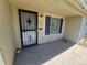 A charming exterior view featuring a secure front door with bars and a welcoming porch at 1303 Havana St, Aurora, CO 80010