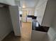 A bright kitchen features white cabinets, tile floors, and modern appliances at 1303 Havana St, Aurora, CO 80010